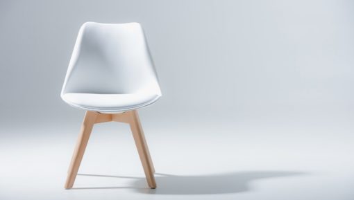 Chair with white top and wooden legs