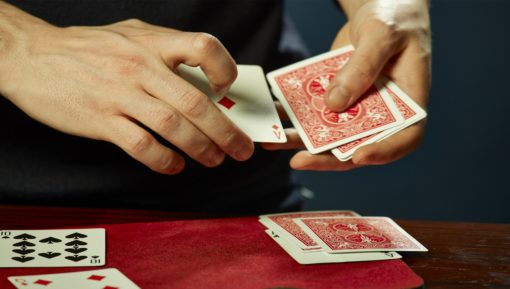 Hands and playing cards trick