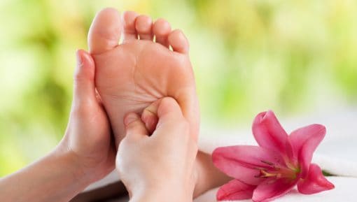 Hands doing foot reflexology