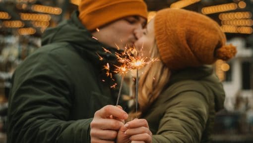 Beautigul couple celebrates together at the christmas market