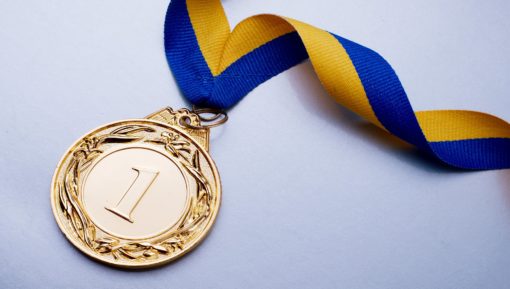 Gold medal on blue