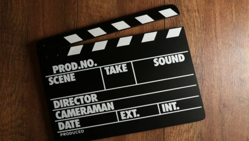 Movie clapper on wooden background