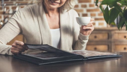 Woman looking at photo album