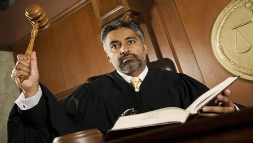 Male Judge Knocking Gavel